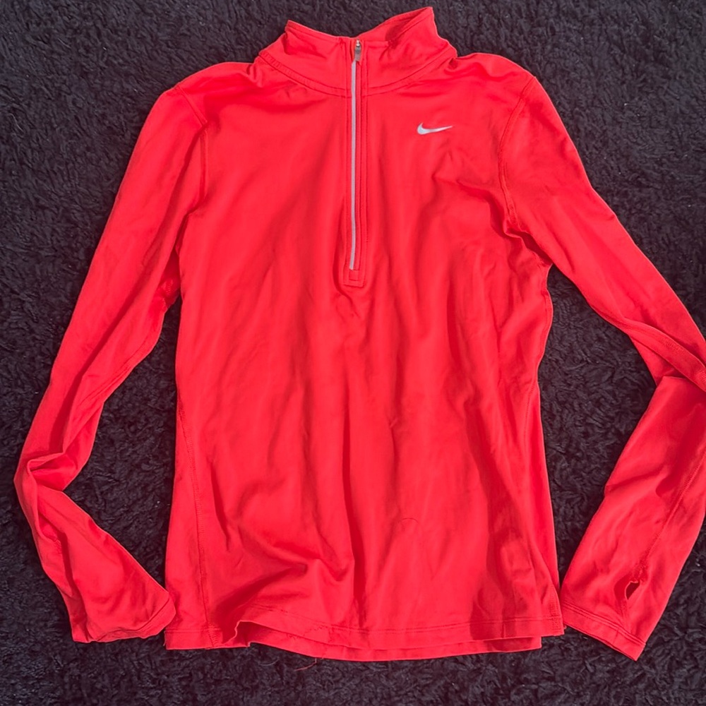 Woman’s size small running 1/4 zip